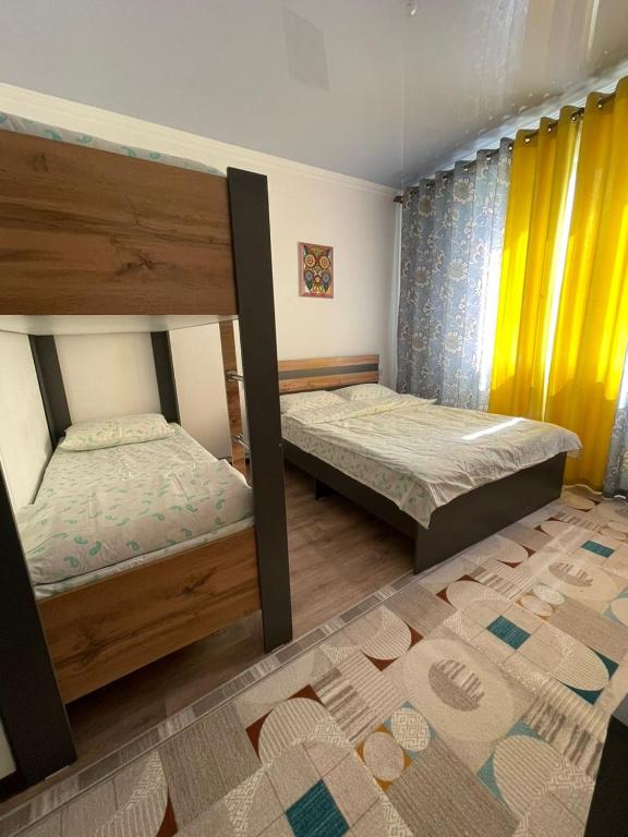 Postel nebo postele na pokoji v ubytování 'Nomad' GUEST HOUSE