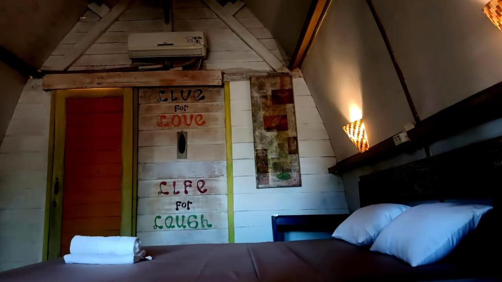 Postel nebo postele na pokoji v ubytování Oceansoul Gili Trawangan