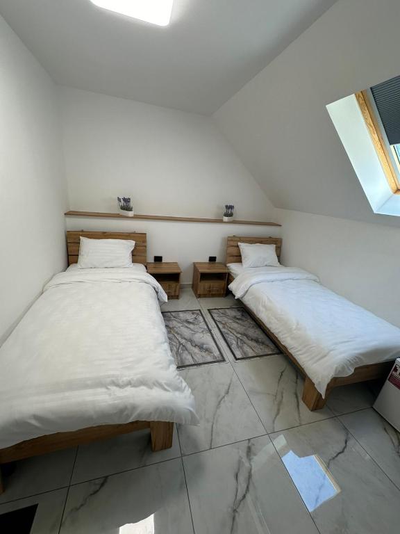 Postel nebo postele na pokoji v ubytování M-23 Hotel