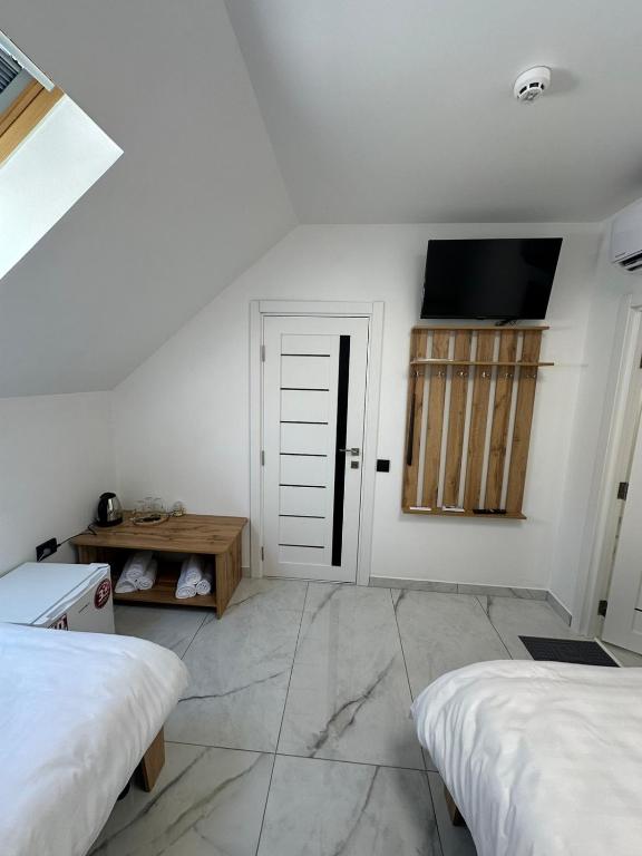 Postel nebo postele na pokoji v ubytování M-23 Hotel