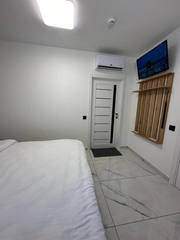Postel nebo postele na pokoji v ubytování M-23 Hotel