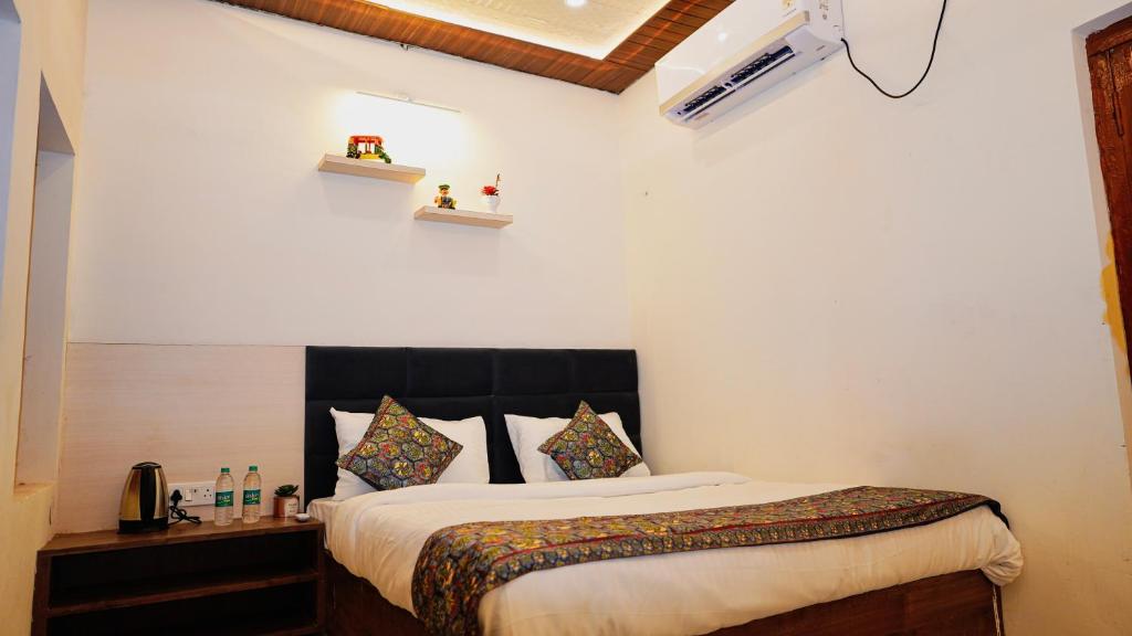 a bedroom with a bed in a room at River Town Stays in Varanasi