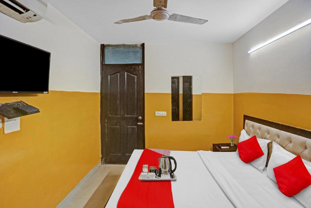 Postel nebo postele na pokoji v ubytování Hotel O SS Paradise