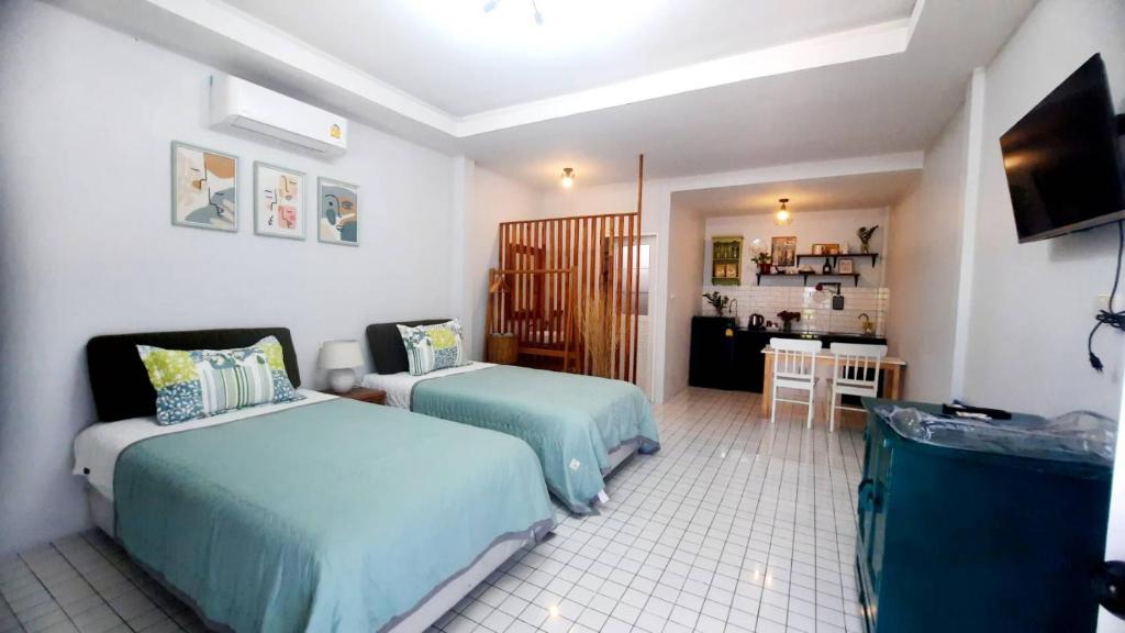 Postel nebo postele na pokoji v ubytování Bann Kam B&B