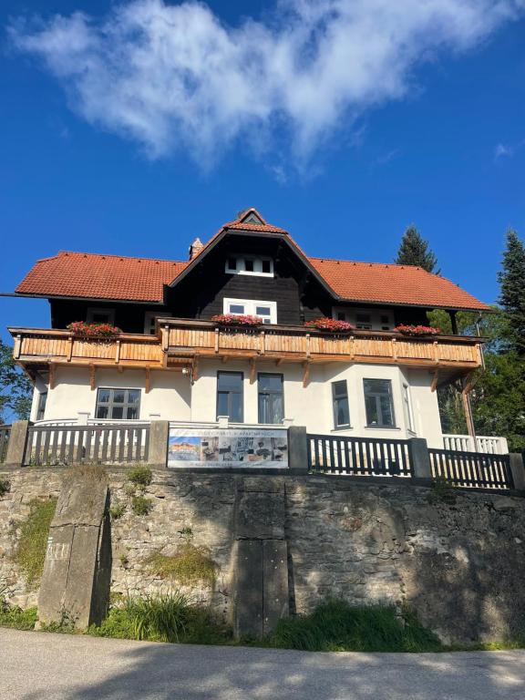 a large house on top of a hill at Apartmánový dům Jánský sen in Janske Lazne