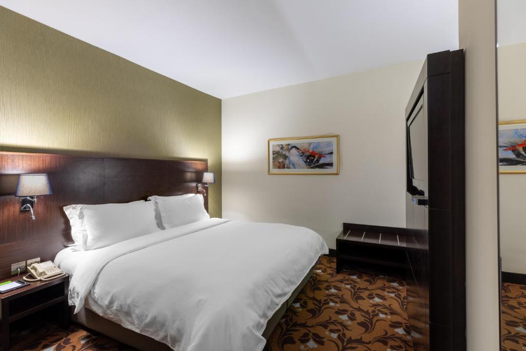 Babylon Rotana Hotelにあるベッド