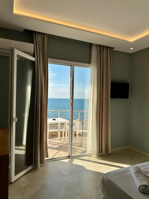 Postel nebo postele na pokoji v ubytování Zeus Hotel