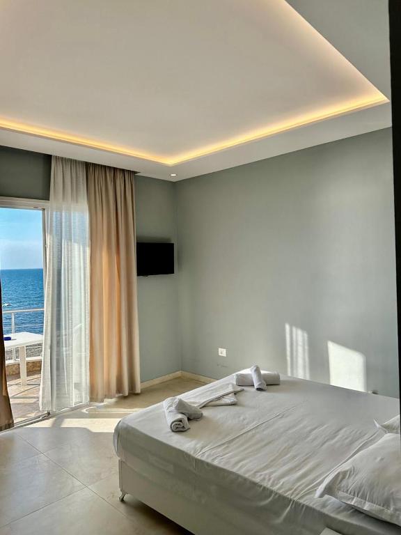 Postel nebo postele na pokoji v ubytování Zeus Hotel