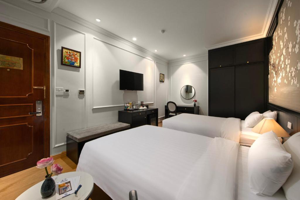 Postel nebo postele na pokoji v ubytování San Premium Hotel