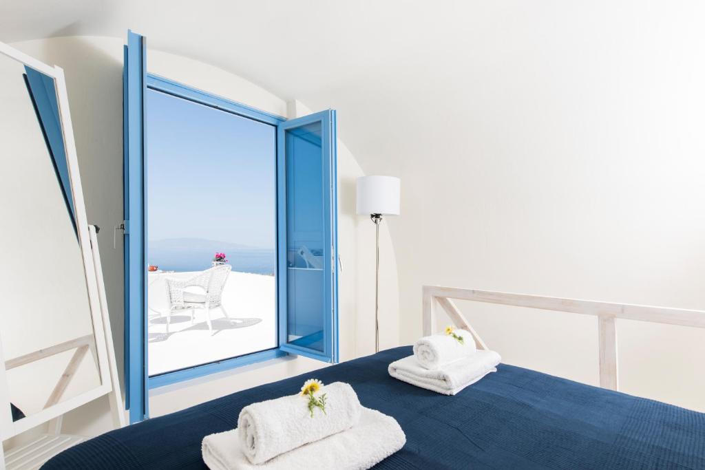 Postel nebo postele na pokoji v ubytování Fava Eco Suites