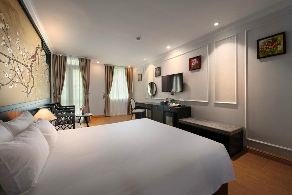 Postel nebo postele na pokoji v ubytování San Premium Hotel