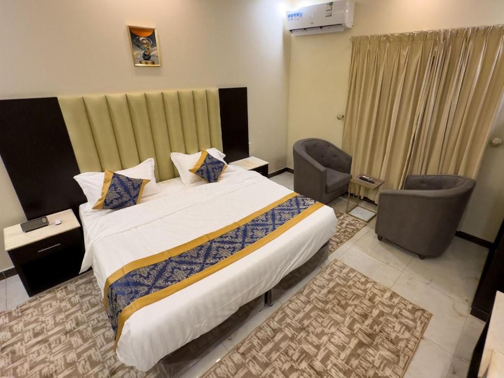 Postel nebo postele na pokoji v ubytování Tamyoz Aparthotel 2