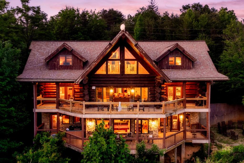 an image of a log cabin at Great Alpine - 4 KingSuites- December Deals-Views-Hot Tub-FirePit-GameRm in Gatlinburg