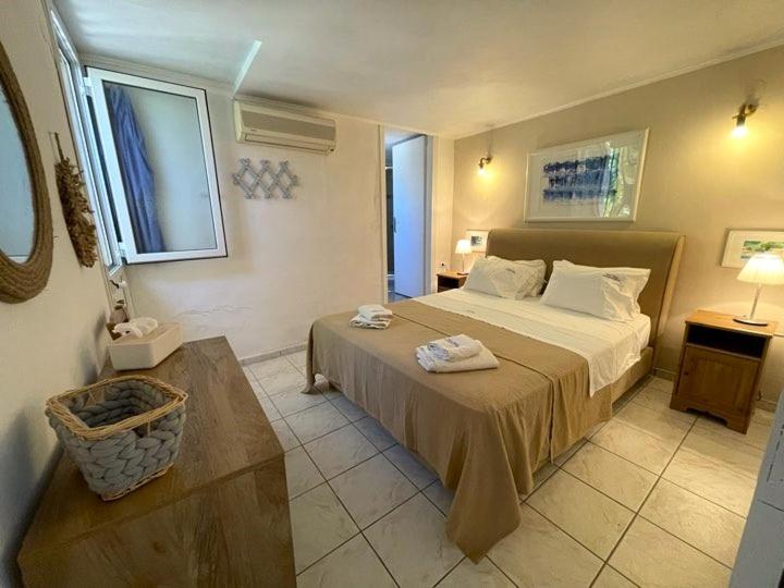 Postel nebo postele na pokoji v ubytování Mare Villa Ciel - by Portogaios Paxos Superior Living