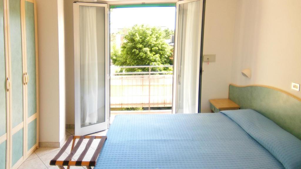 Postel nebo postele na pokoji v ubytování Hotel Vallechiara