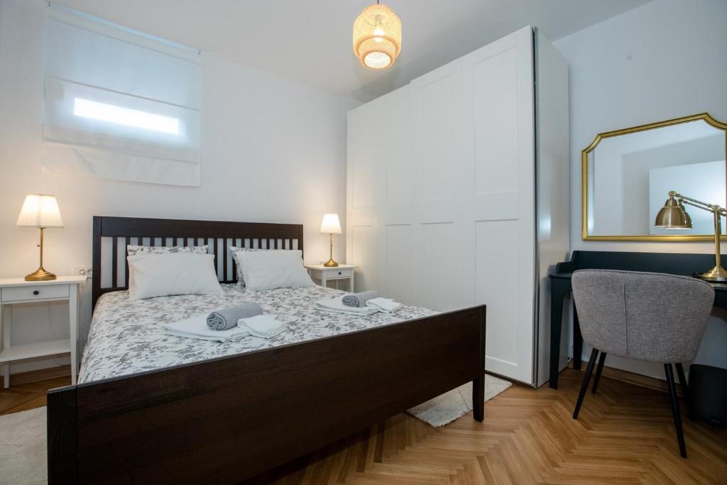 Кровать или кровати в номере Apartmet Jadran