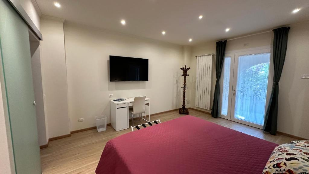 Postel nebo postele na pokoji v ubytování B&B La Giganta