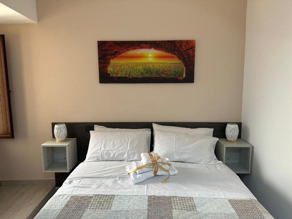 Postel nebo postele na pokoji v ubytování KALGHEROS Luxury Rooms