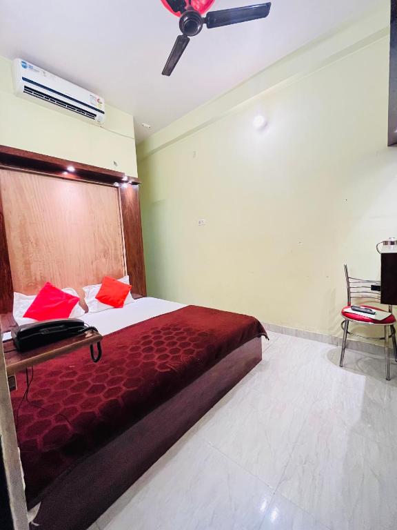 Postel nebo postele na pokoji v ubytování Rameshwaram Guest House