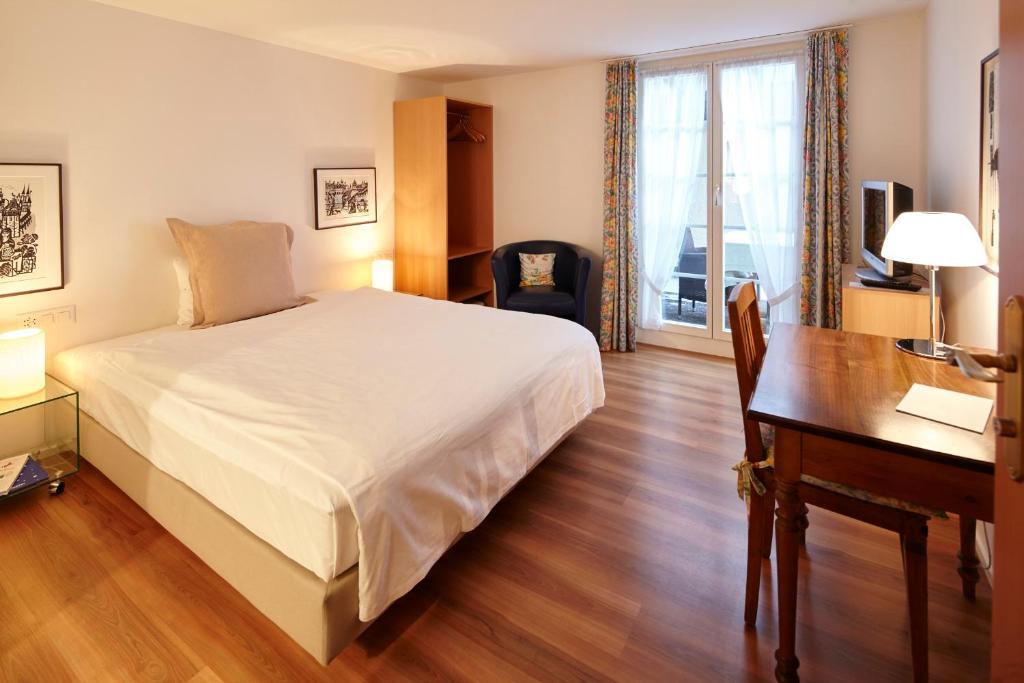 Postel nebo postele na pokoji v ubytování Landgasthof Hotel Rössli