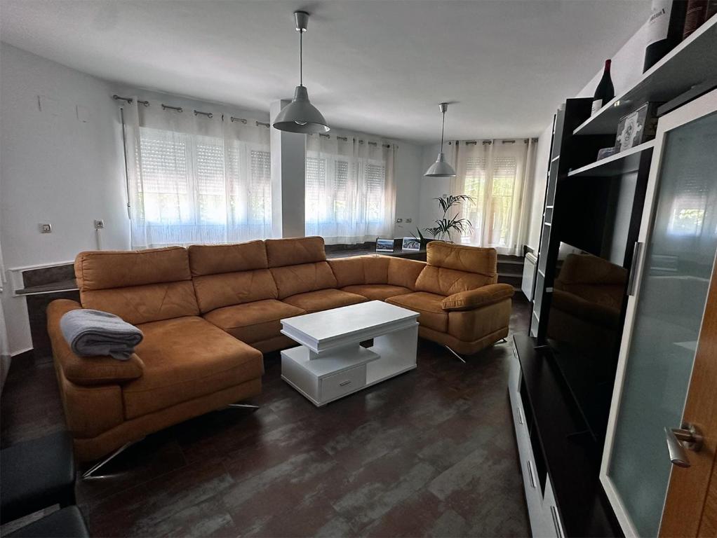 a living room with a couch and a table at Casa Vila in Riópar