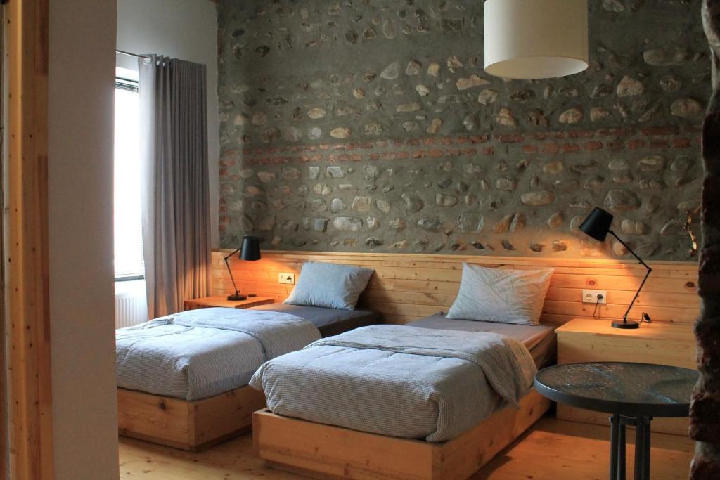 Postel nebo postele na pokoji v ubytování Lokokina Guesthouse