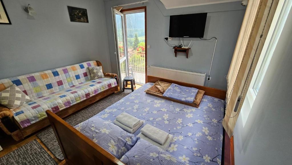 Postel nebo postele na pokoji v ubytování Apartmani Maksimović