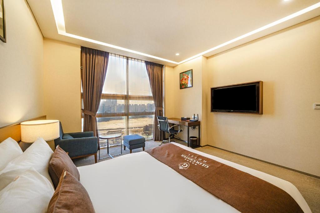 Postel nebo postele na pokoji v ubytování Gloucester Hotel Incheon
