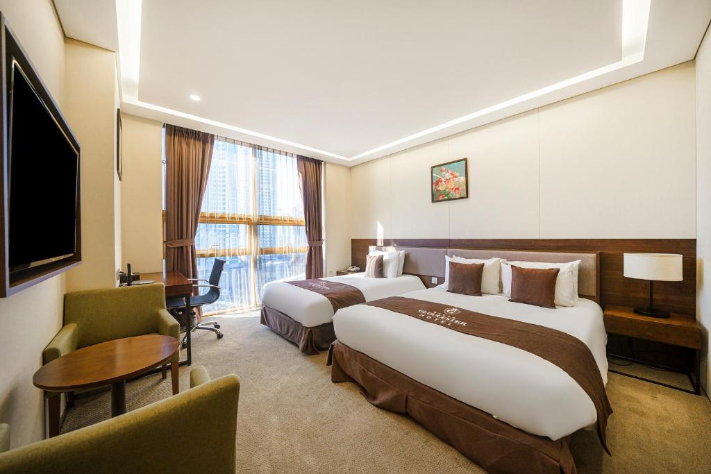 Postel nebo postele na pokoji v ubytování Gloucester Hotel Incheon