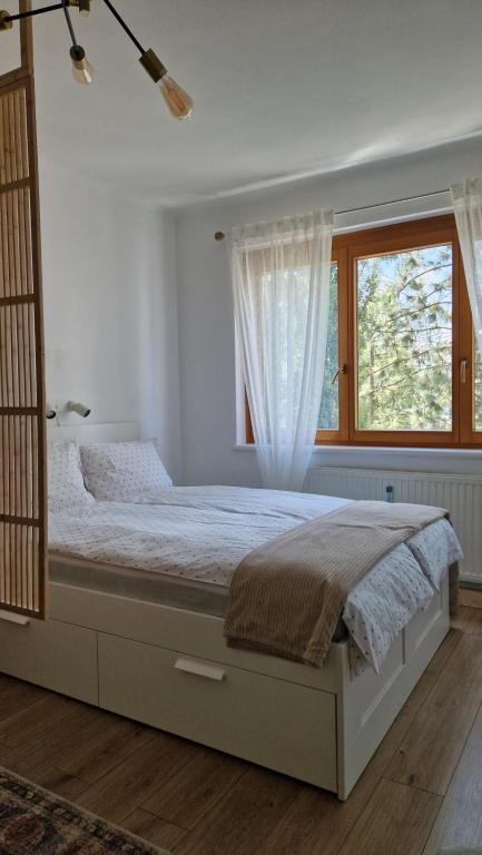 Postel nebo postele na pokoji v ubytování Cosy Apartment with a Magnificent View