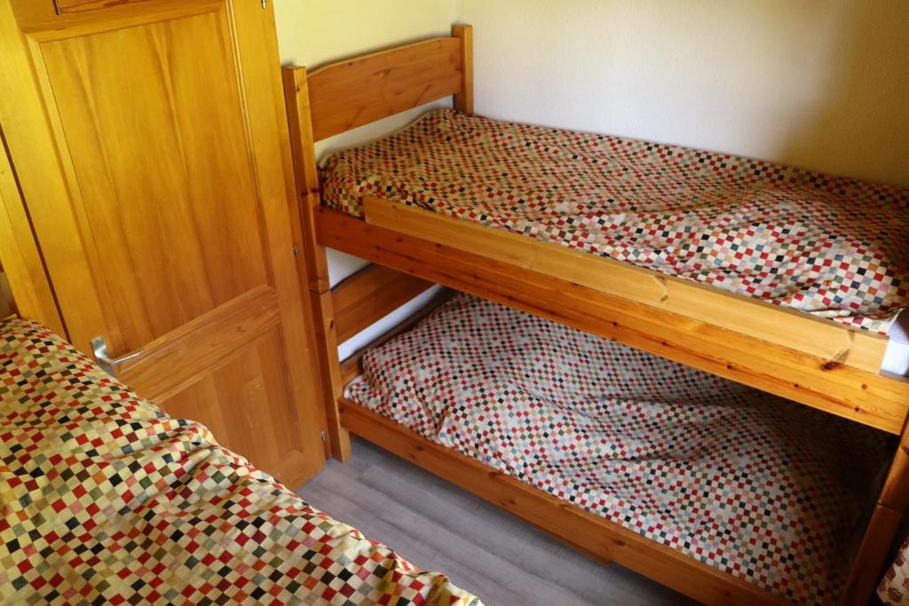 Postel nebo postele na pokoji v ubytování Le Petit Refuge - Lupins