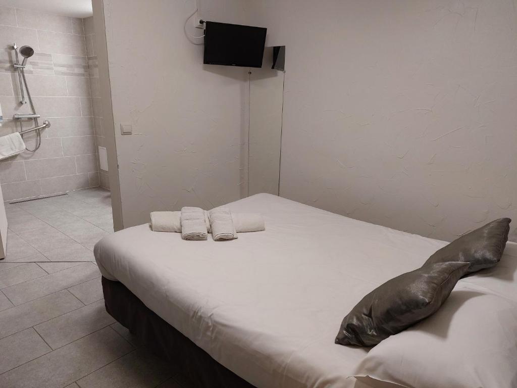 Postel nebo postele na pokoji v ubytování Brit Hotel Bosquet Carcassonne Cité