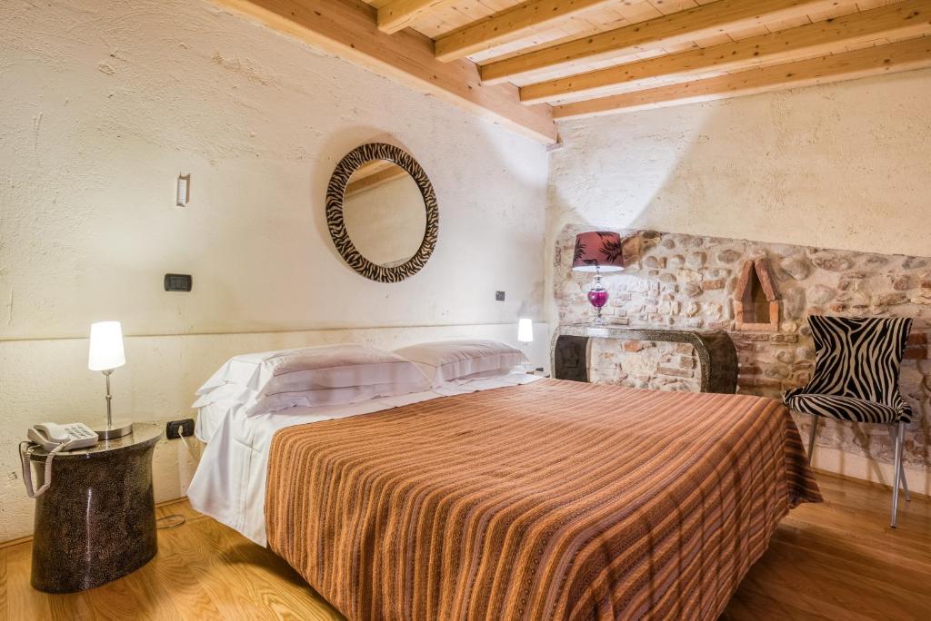 Postel nebo postele na pokoji v ubytování Boutique Hotel Scalzi - Adults Only