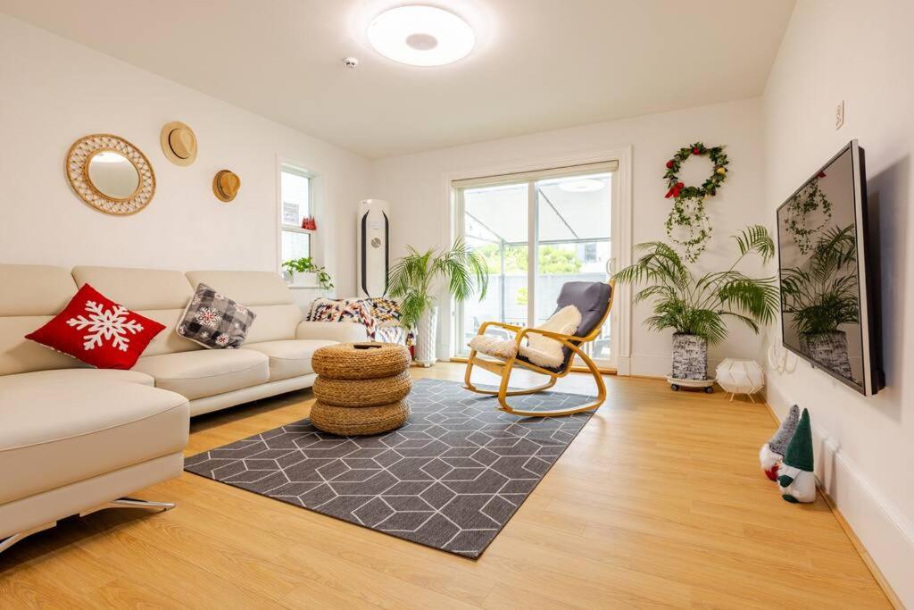 a living room with a couch and a chair at All in one Guesthouse in Incheon