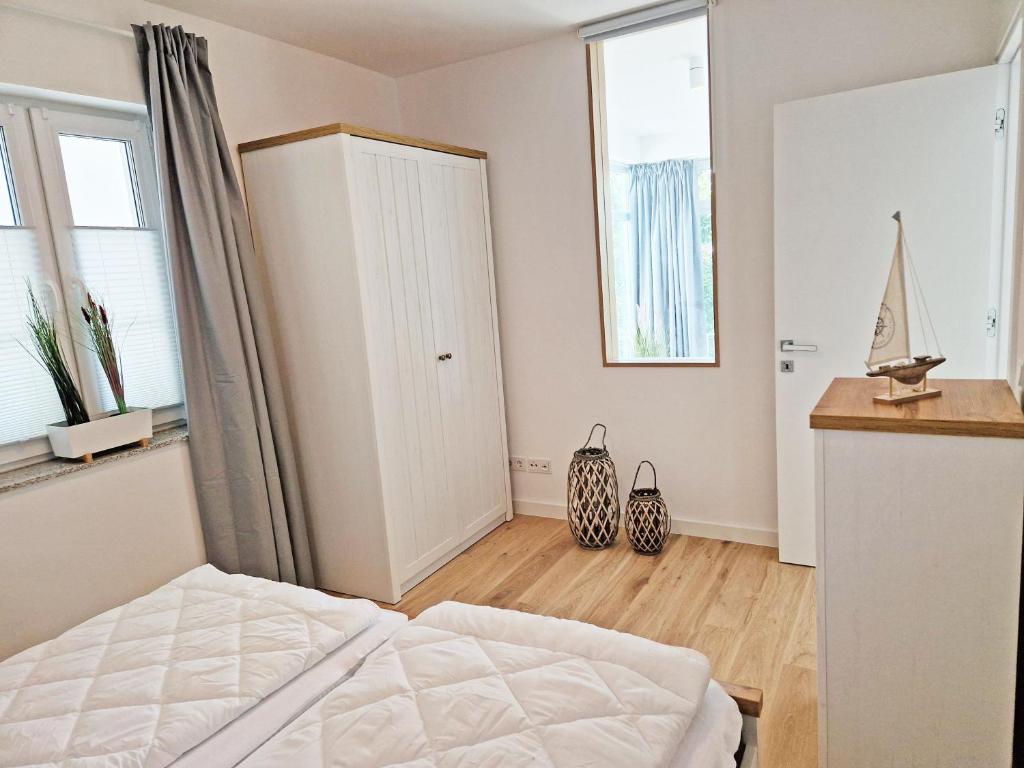 Postel nebo postele na pokoji v ubytování Villa Küstenperle, Meerblick-Appartements