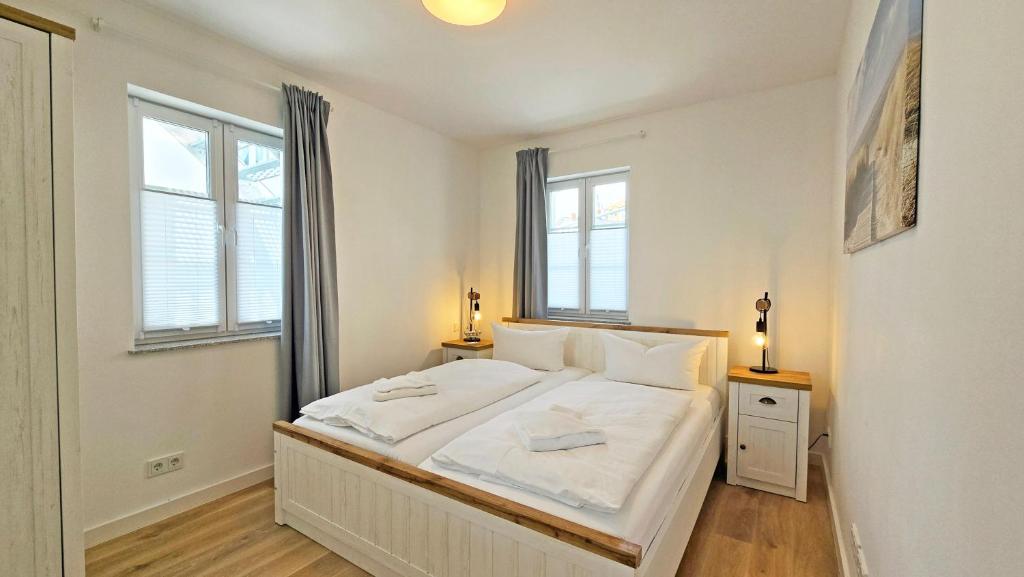 Postel nebo postele na pokoji v ubytování Villa Küstenperle, Meerblick-Appartements