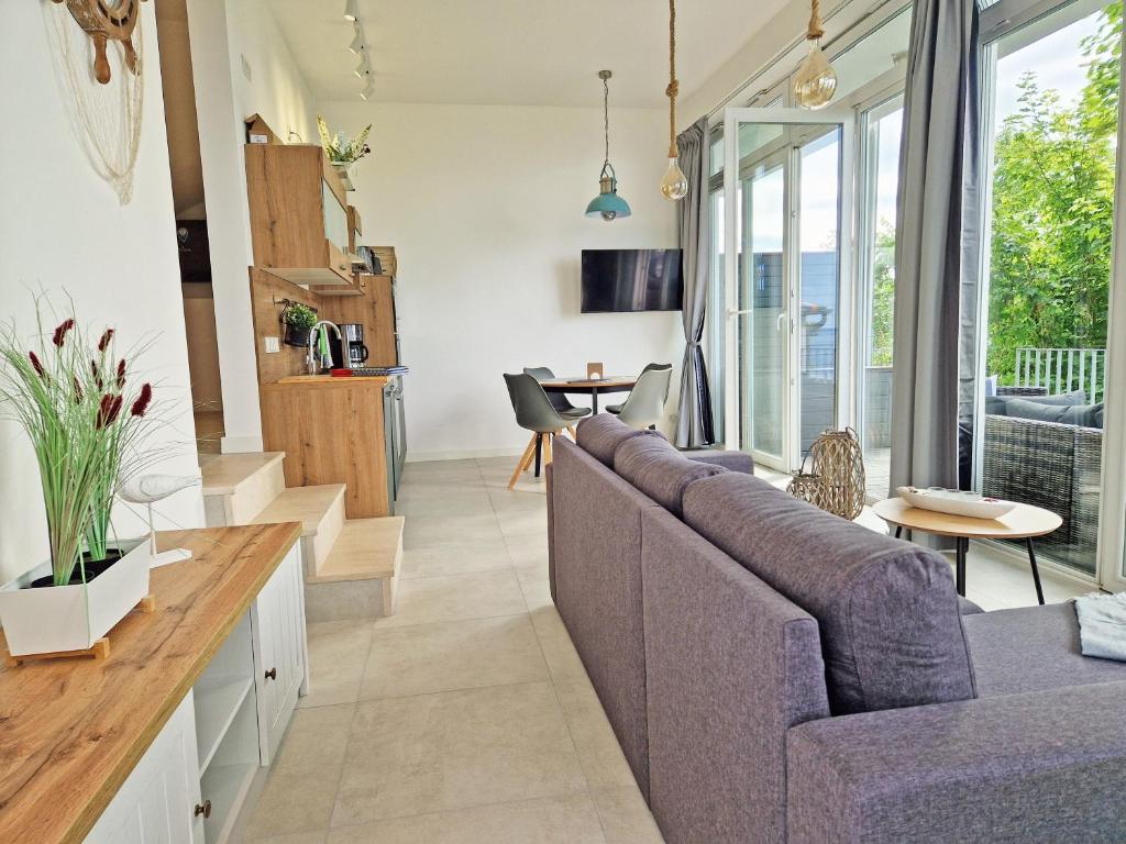 TV a/nebo společenská místnost v ubytování Villa Küstenperle, Meerblick-Appartements