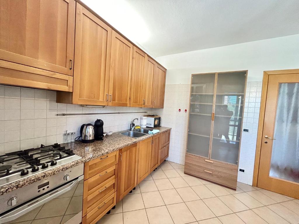Η κουζίνα ή μικρή κουζίνα στο Calima Apartments 2 Venezia