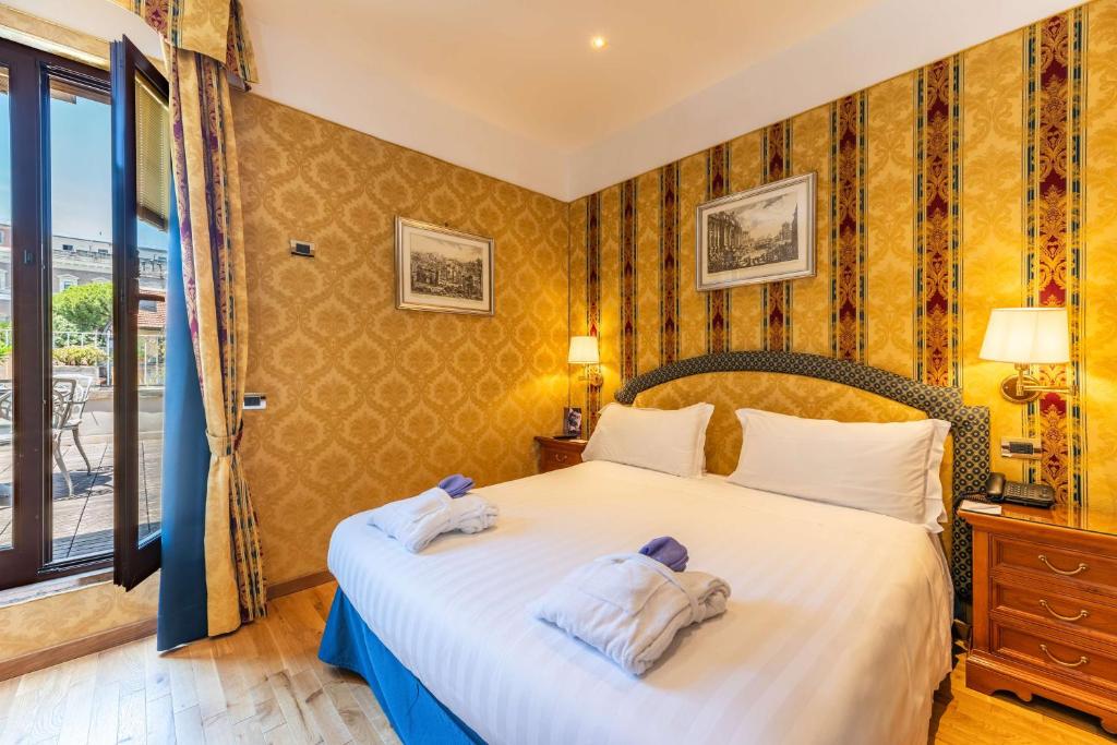 Postel nebo postele na pokoji v ubytování Hotel Raffaello - Sure Hotel Collection by Best Western