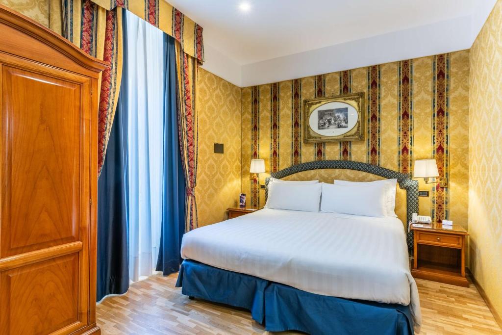 Postel nebo postele na pokoji v ubytování Hotel Raffaello - Sure Hotel Collection by Best Western