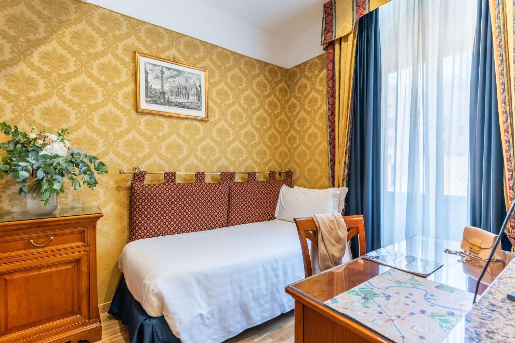 Postel nebo postele na pokoji v ubytování Hotel Raffaello - Sure Hotel Collection by Best Western