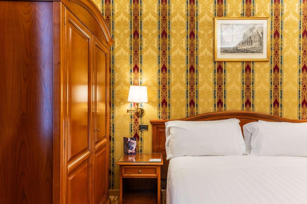 Postel nebo postele na pokoji v ubytování Hotel Raffaello - Sure Hotel Collection by Best Western