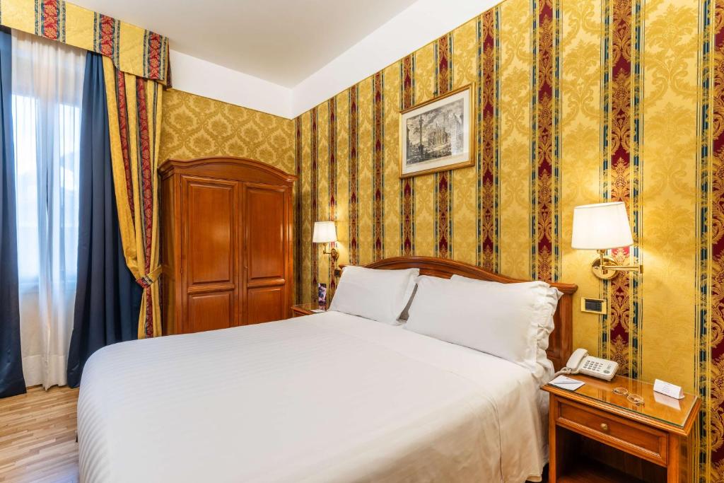Postel nebo postele na pokoji v ubytování Hotel Raffaello - Sure Hotel Collection by Best Western