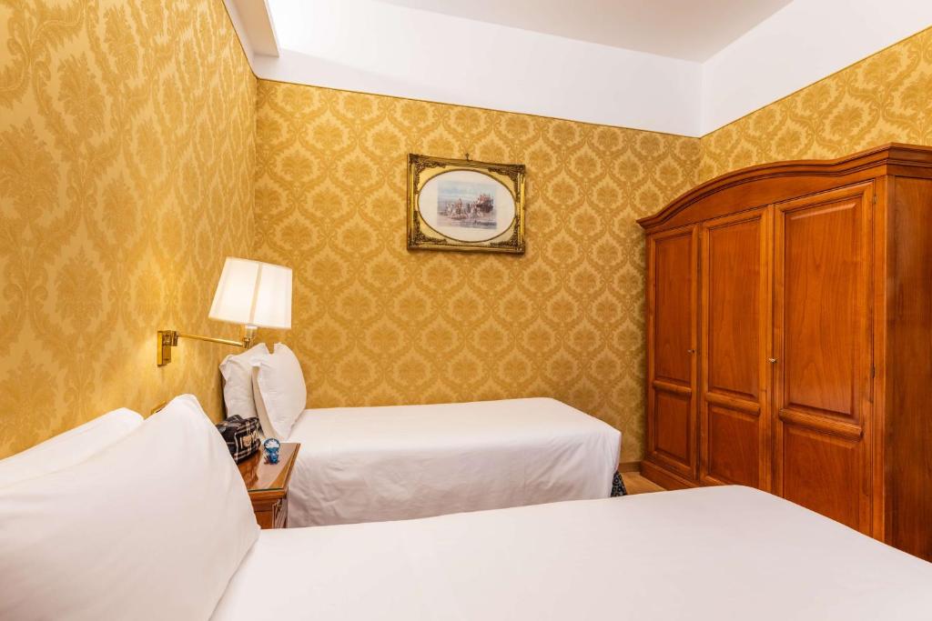Postel nebo postele na pokoji v ubytování Hotel Raffaello - Sure Hotel Collection by Best Western