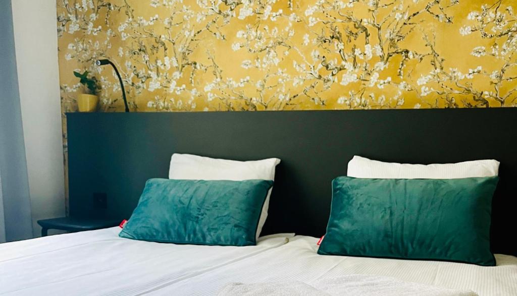 Postel nebo postele na pokoji v ubytování Hotel Sutor