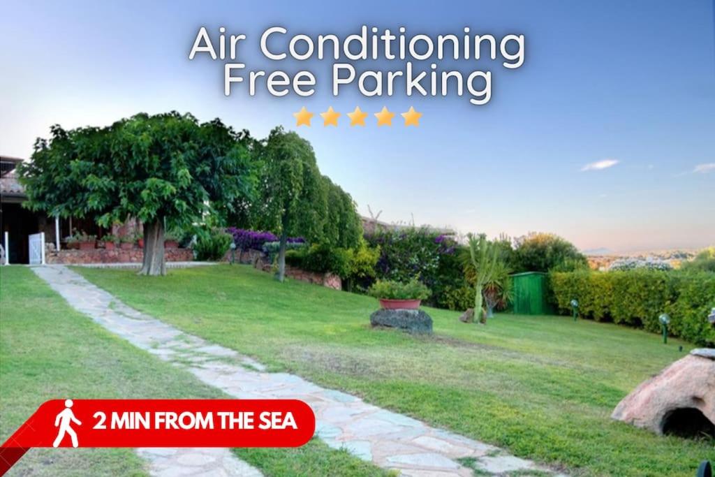 a sign that says air conditioning free parking in a yard at Villa Costa Smeralda Golfo di Marinella AC e WiFi in Golfo Aranci