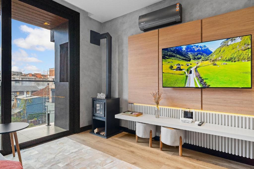 Televisyen dan/atau pusat hiburan di Welter You 1dorm e Piscina Aquecida by Achei