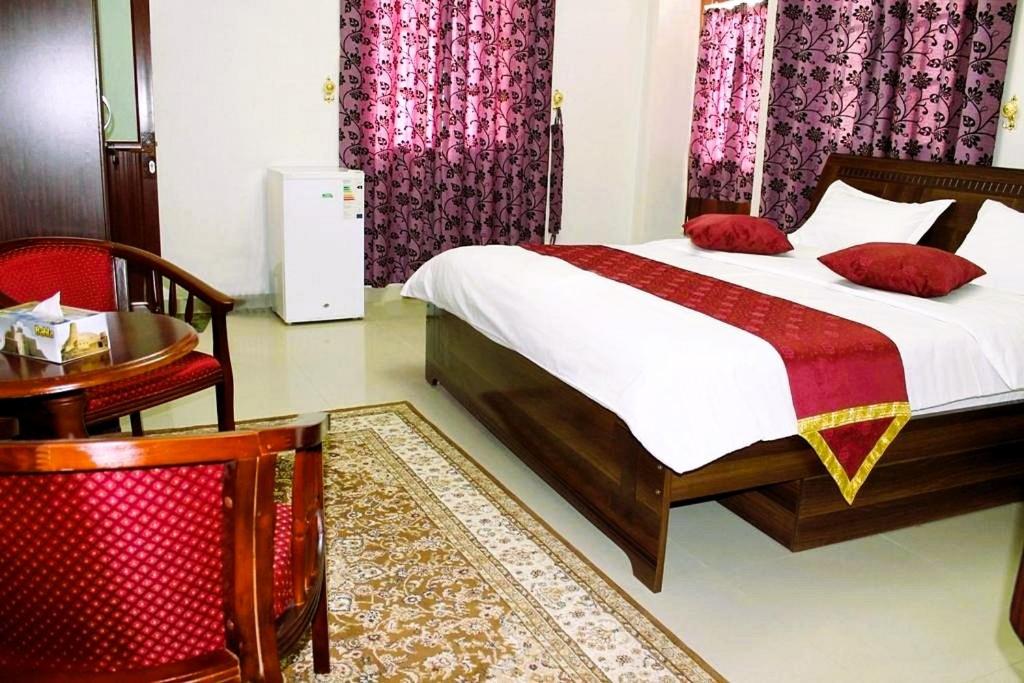 Postel nebo postele na pokoji v ubytování Bahla Hotel Apartments