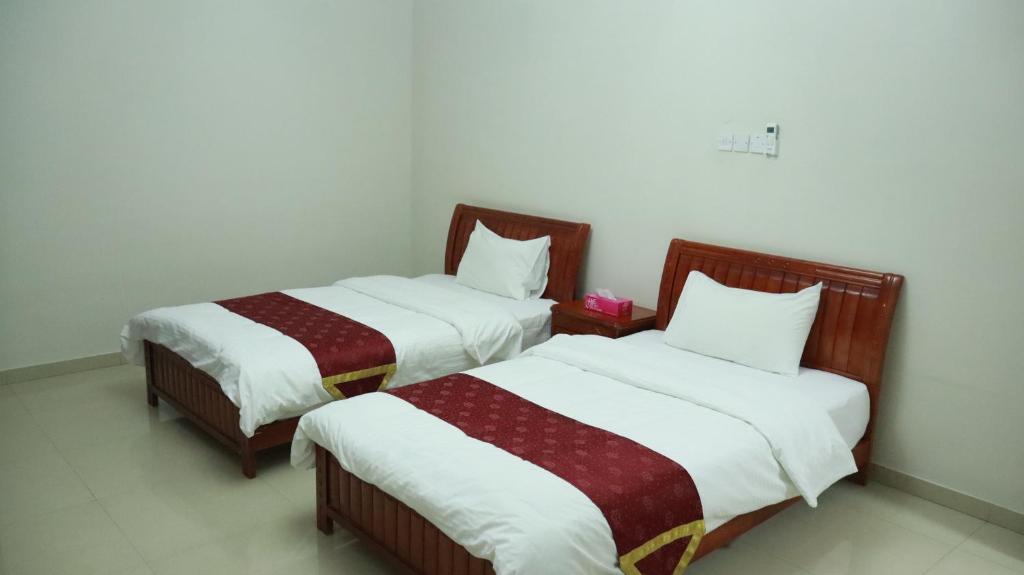Postel nebo postele na pokoji v ubytování Bahla Hotel Apartments