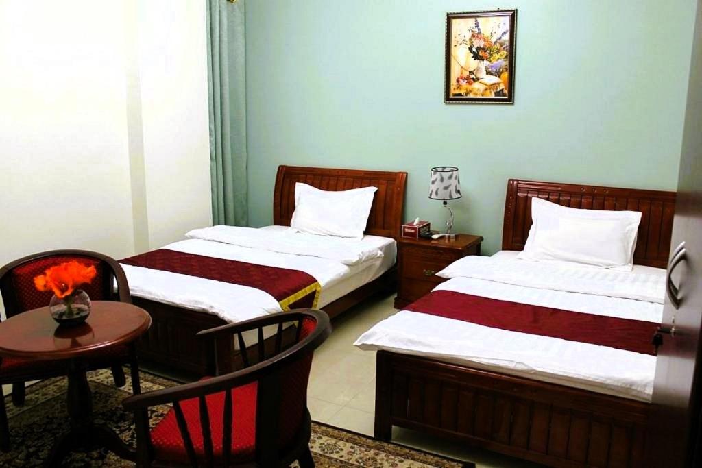 Postel nebo postele na pokoji v ubytování Bahla Hotel Apartments